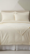 Sleepora Ivory Cream Cotton Sheet Set, front view on neutral background