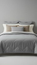 Sleepora Mist Grey Quilted Coverlet, front view on neutral background