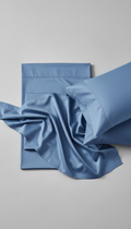 Sleepora Powder Blue Cotton Sheet Set, front view on neutral background