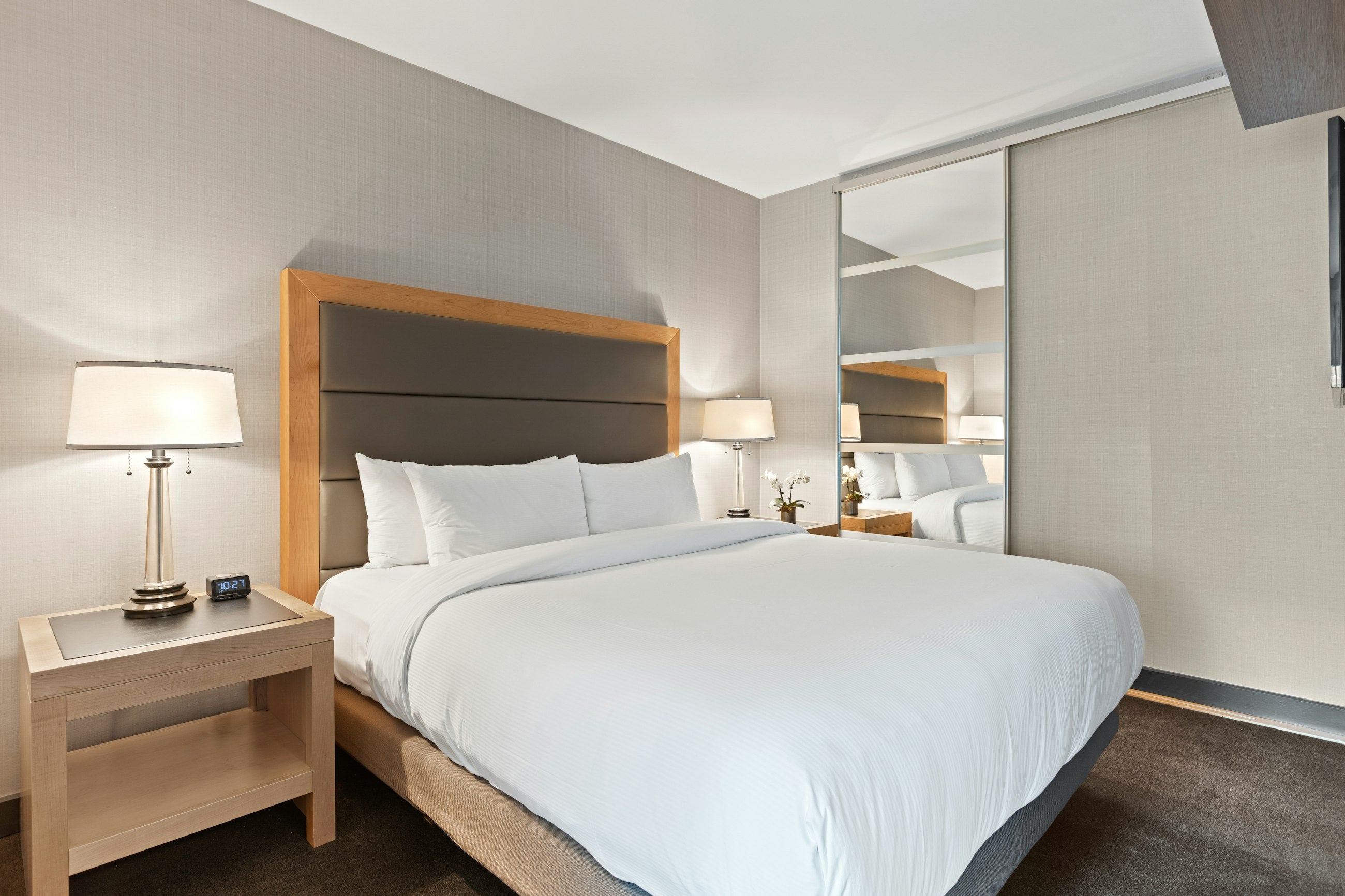 Cozy neutral-toned bedroom with soft bedding