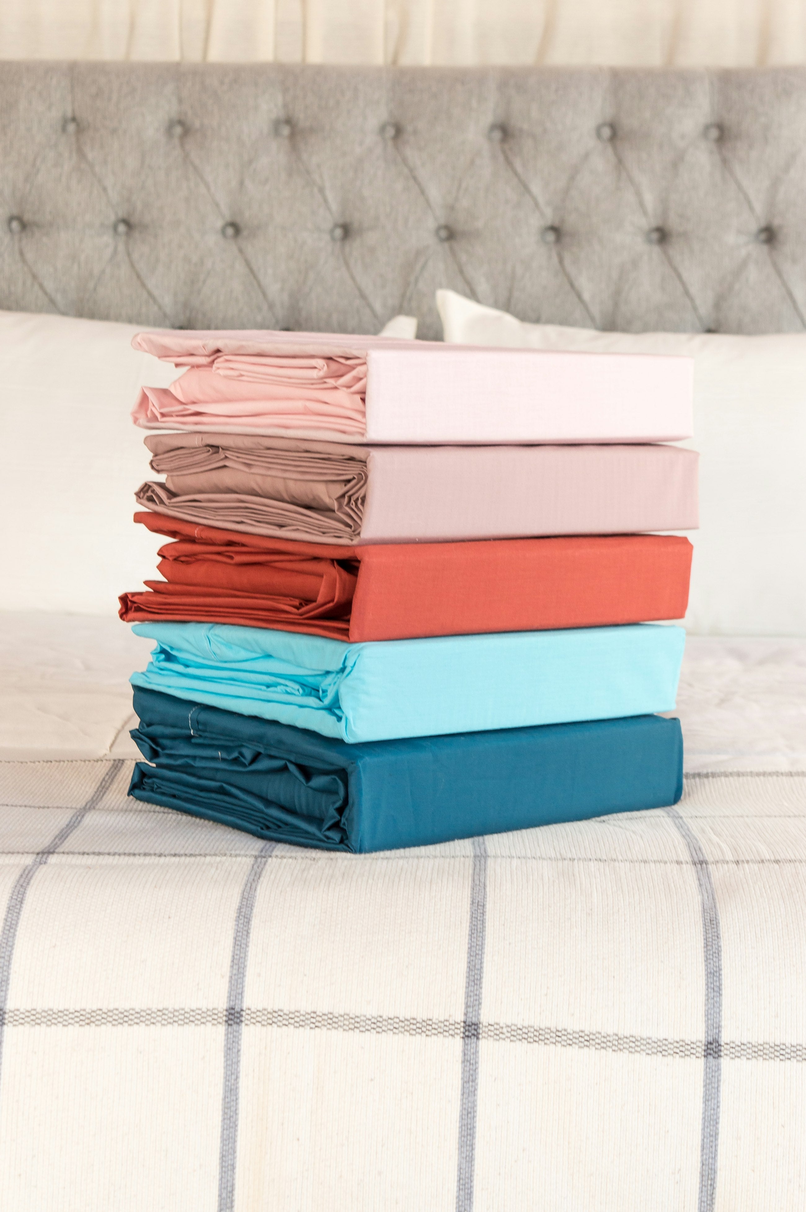 Stack of neatly folded soft linens